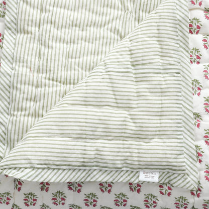 Striped fabric with a floral patterned border