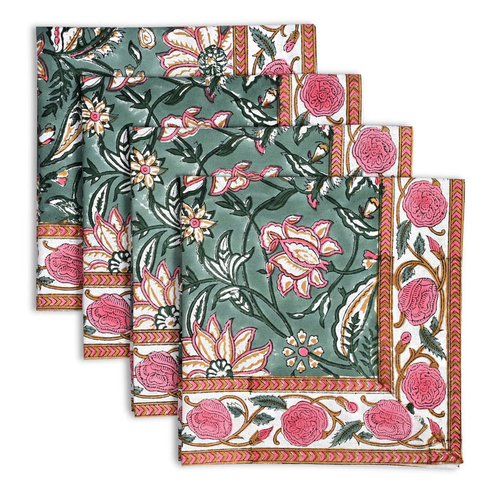 Set of floral patterned napkins with pink and green colors on a white background