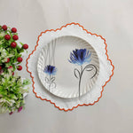 White linen round table mats with scallop edges in orange for table decor