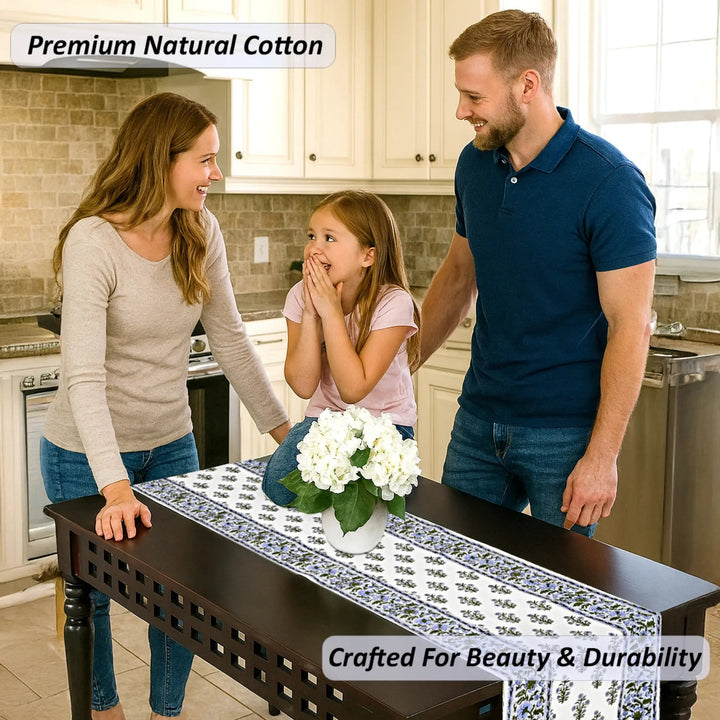 Family in a kitchen with a table runner displaying &