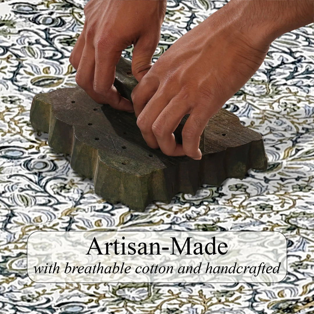 Hands using a wooden tool on a patterned fabric with &