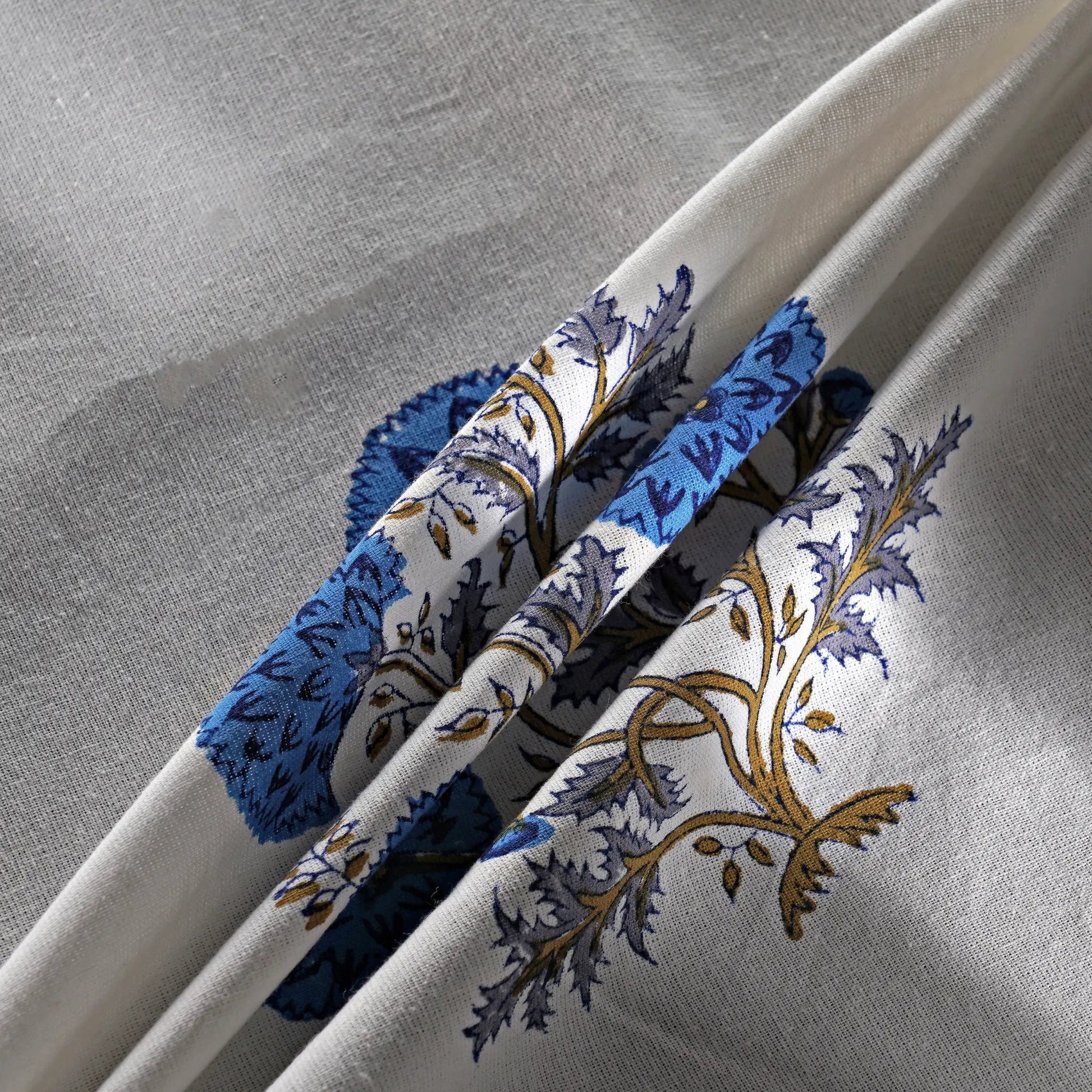 Decorative headbands with floral patterns on a gray background