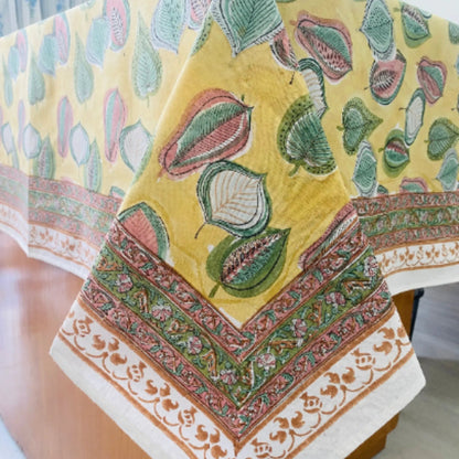 Decorative tablecloth with floral patterns on a yellow background