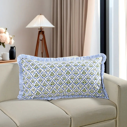 Blue floral block print cotton pillow styled on a beige sofa in living room.