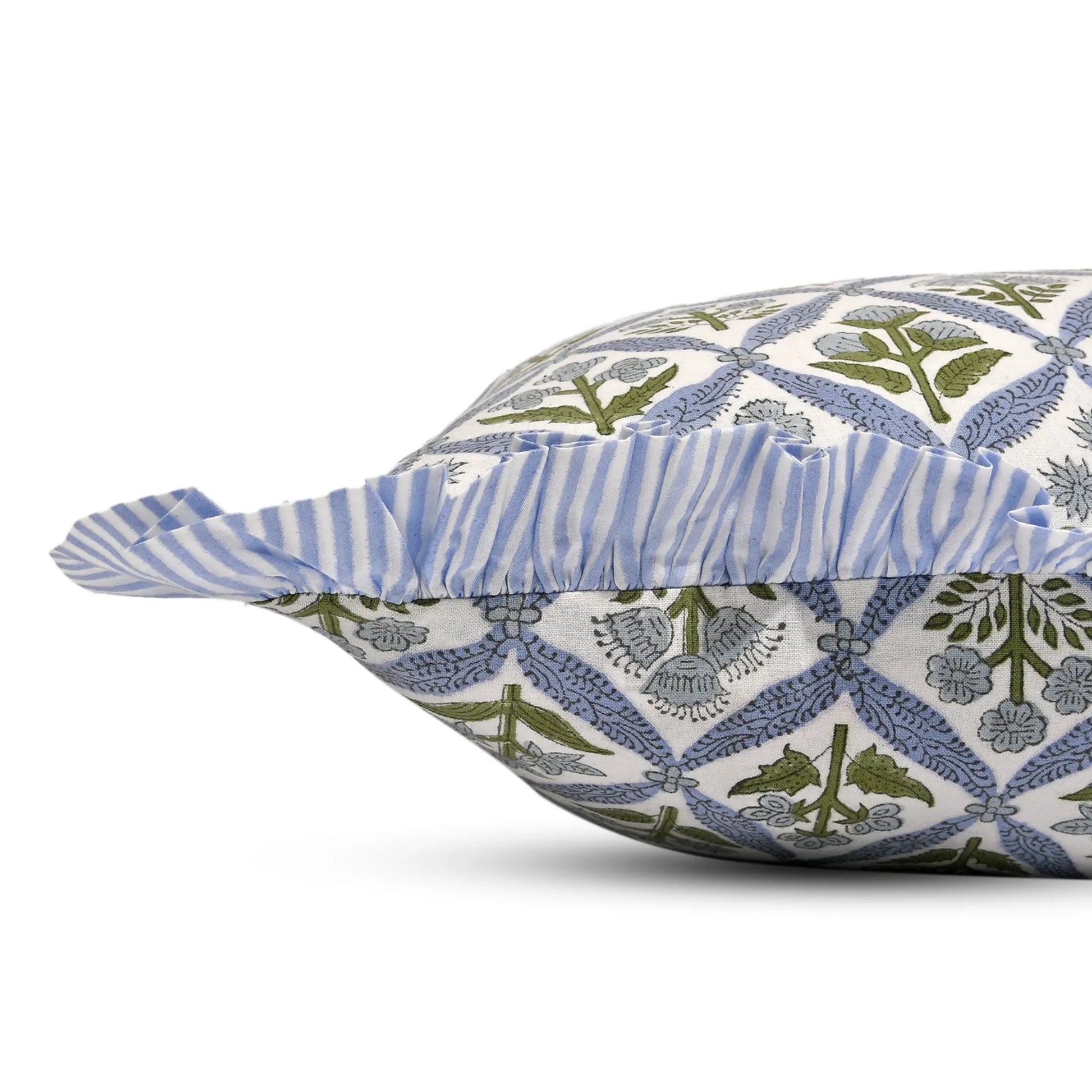 Decorative pillow with blue and green pattern on a white background