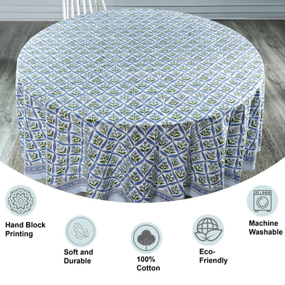 Round tablecloth with geometric pattern on a wooden floor, featuring icons and text about product features.