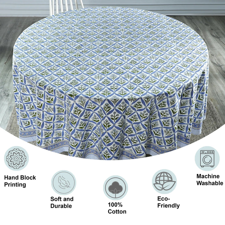 Round tablecloth with geometric pattern on a wooden floor, featuring icons and text about product features.