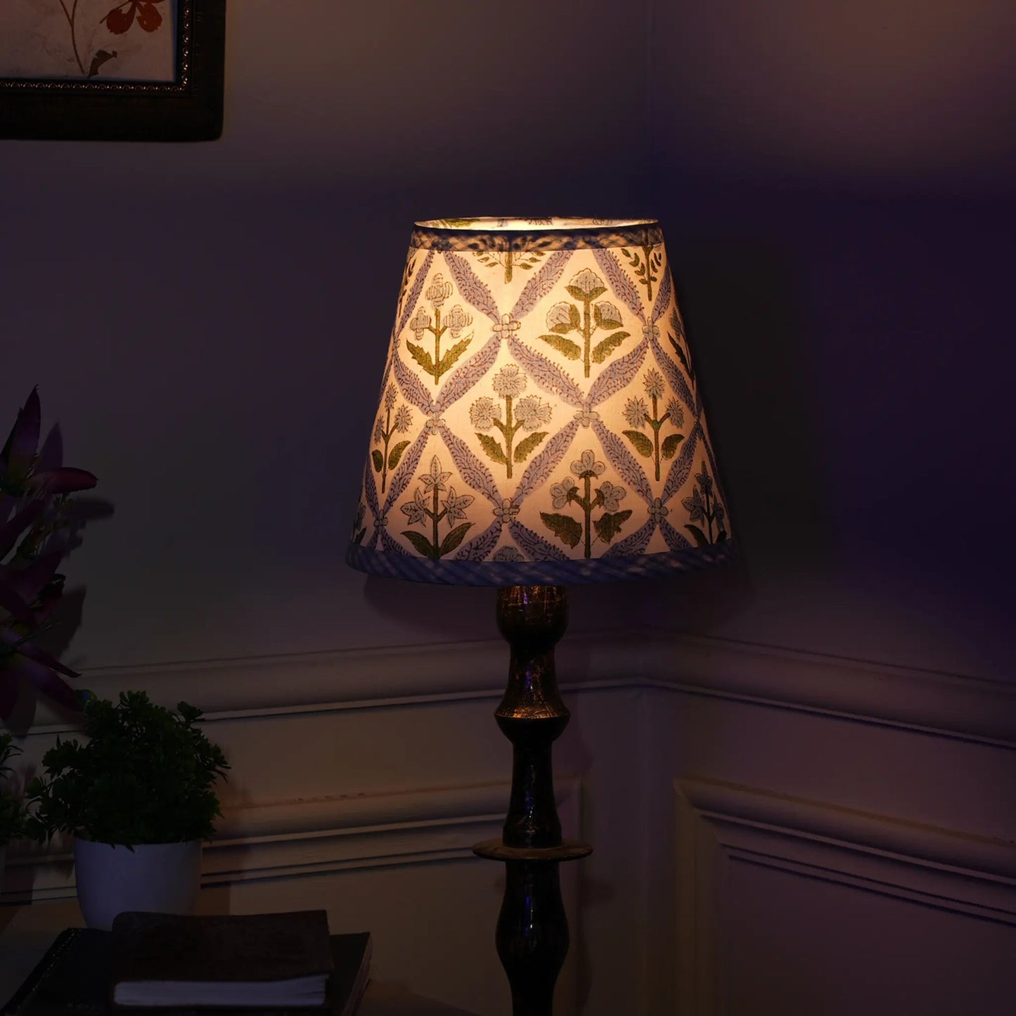 Decorative lamp with floral pattern on a dark background
