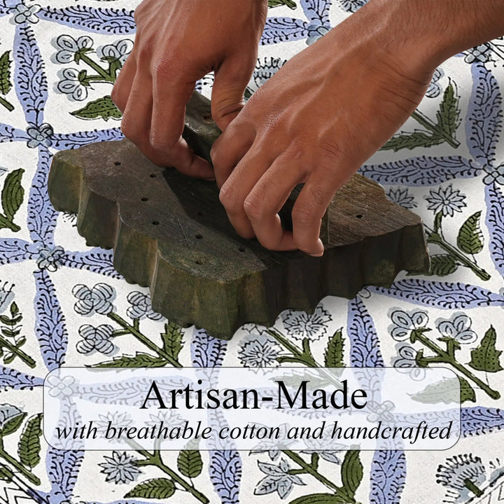 Hands using a stamp on fabric with floral pattern, text &