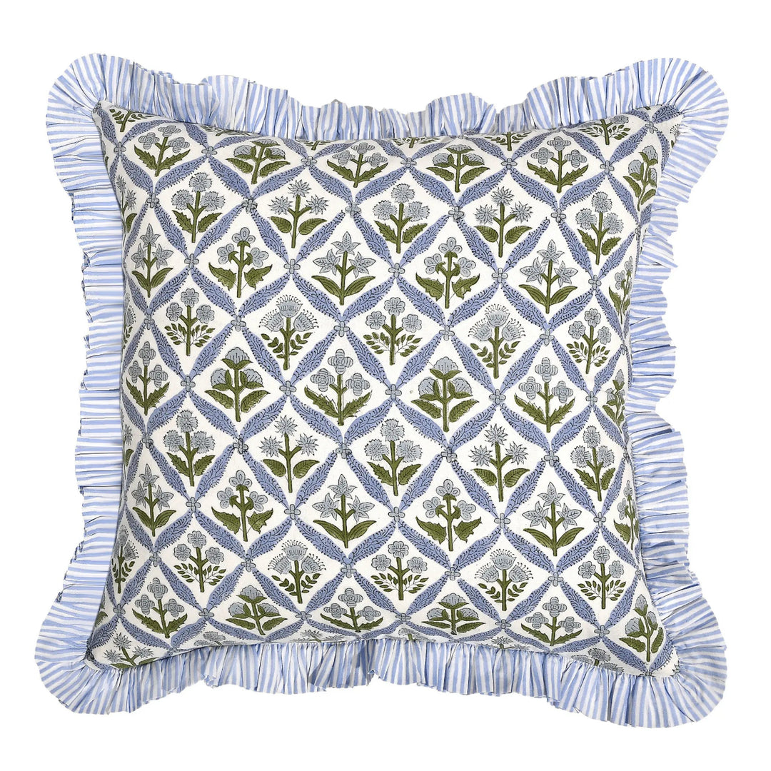 Decorative pillow with geometric floral pattern and blue ruffled edge on a white background
