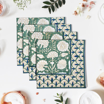 Set of floral patterned napkins on a white surface with decorative elements.