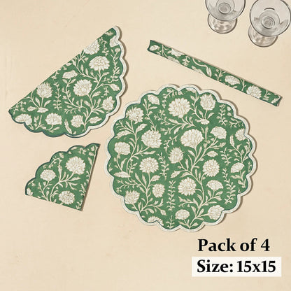 Set of green and white floral placemats on a beige background