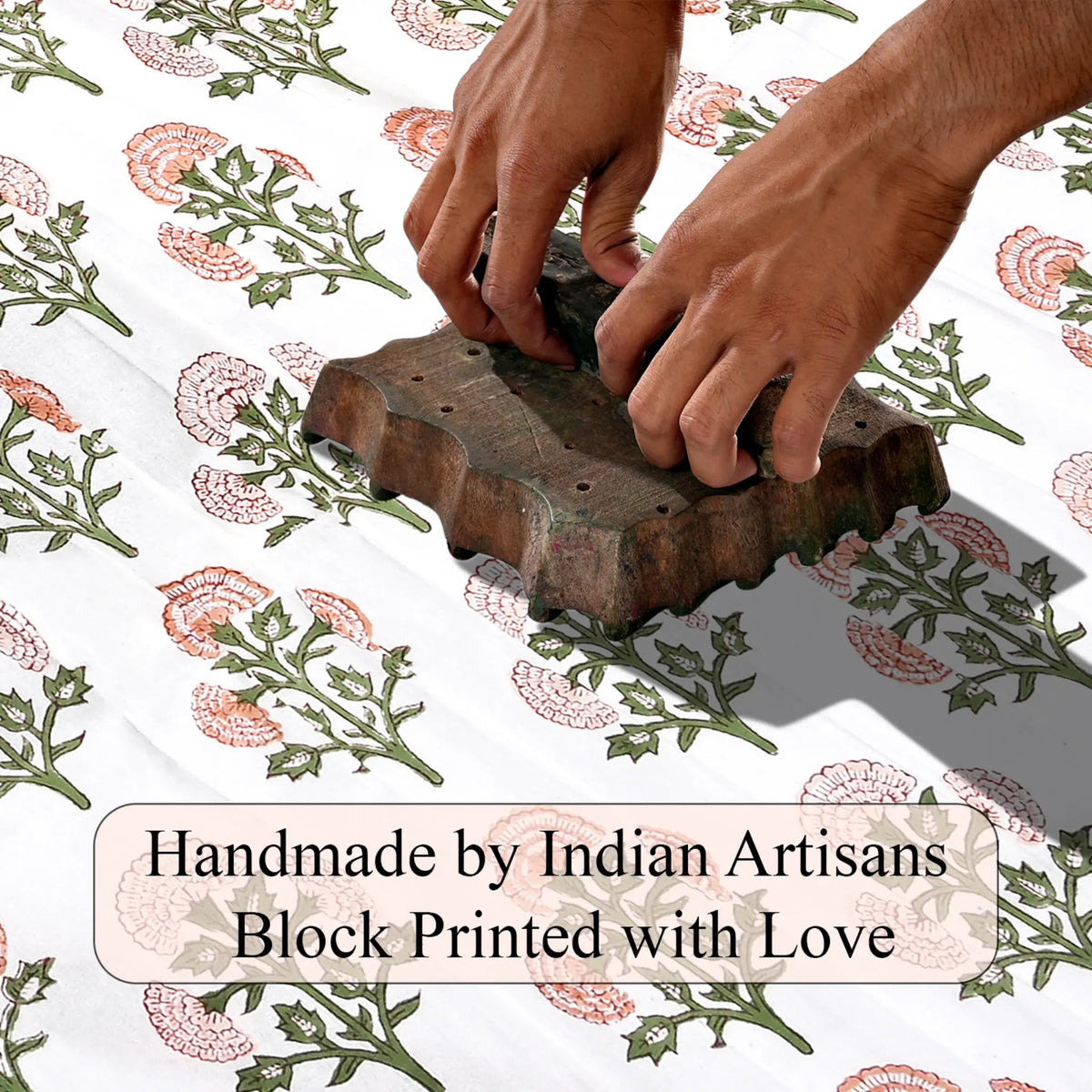 Hand block printing on fabric with text 'Handmade by Indian Artisans Block Printed with Love'.