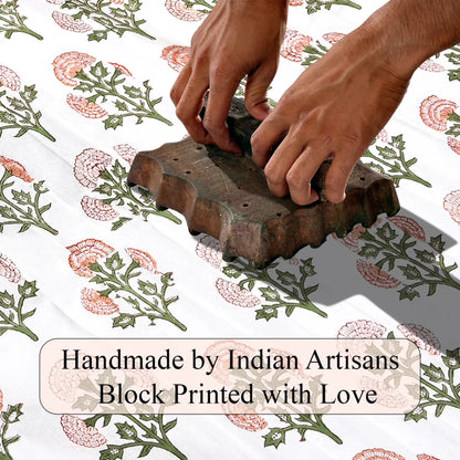 Hand block printing on fabric with text 'Handmade by Indian Artisans Block Printed with Love'.