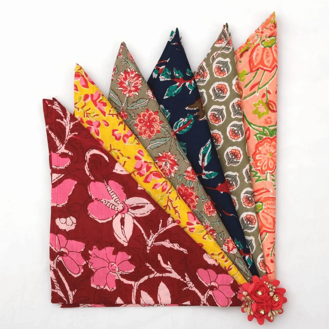 Set of colorful fabric swatches with floral patterns on a white background