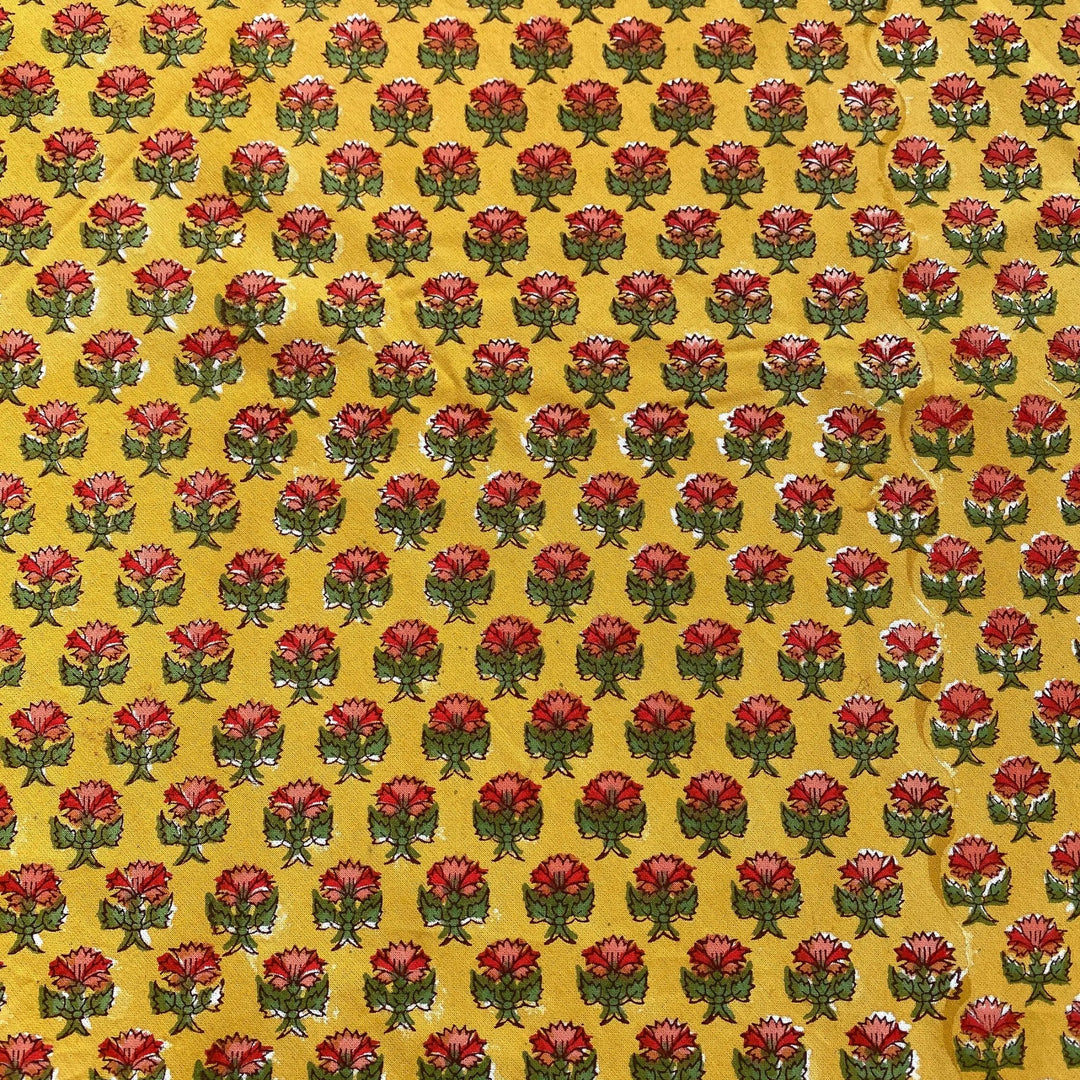 Pattern of red flowers with green stems on a yellow background