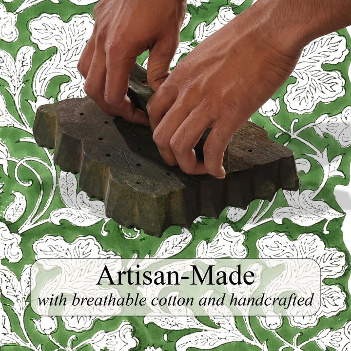 Hands using a wooden tool on a green and white patterned background with &