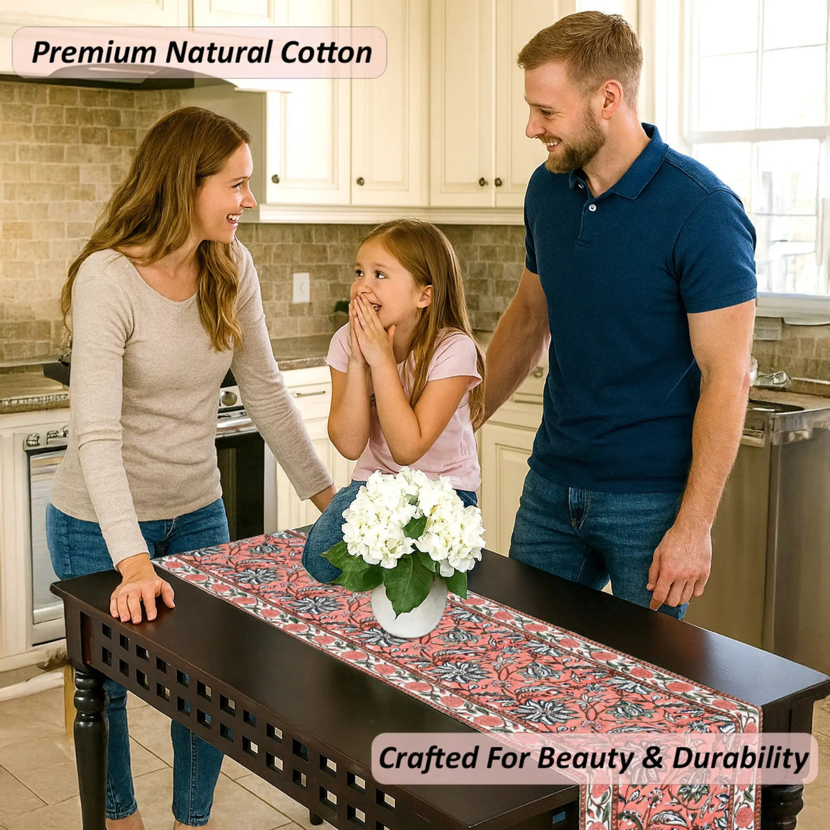 Family in a kitchen with a table runner featuring white flowers.