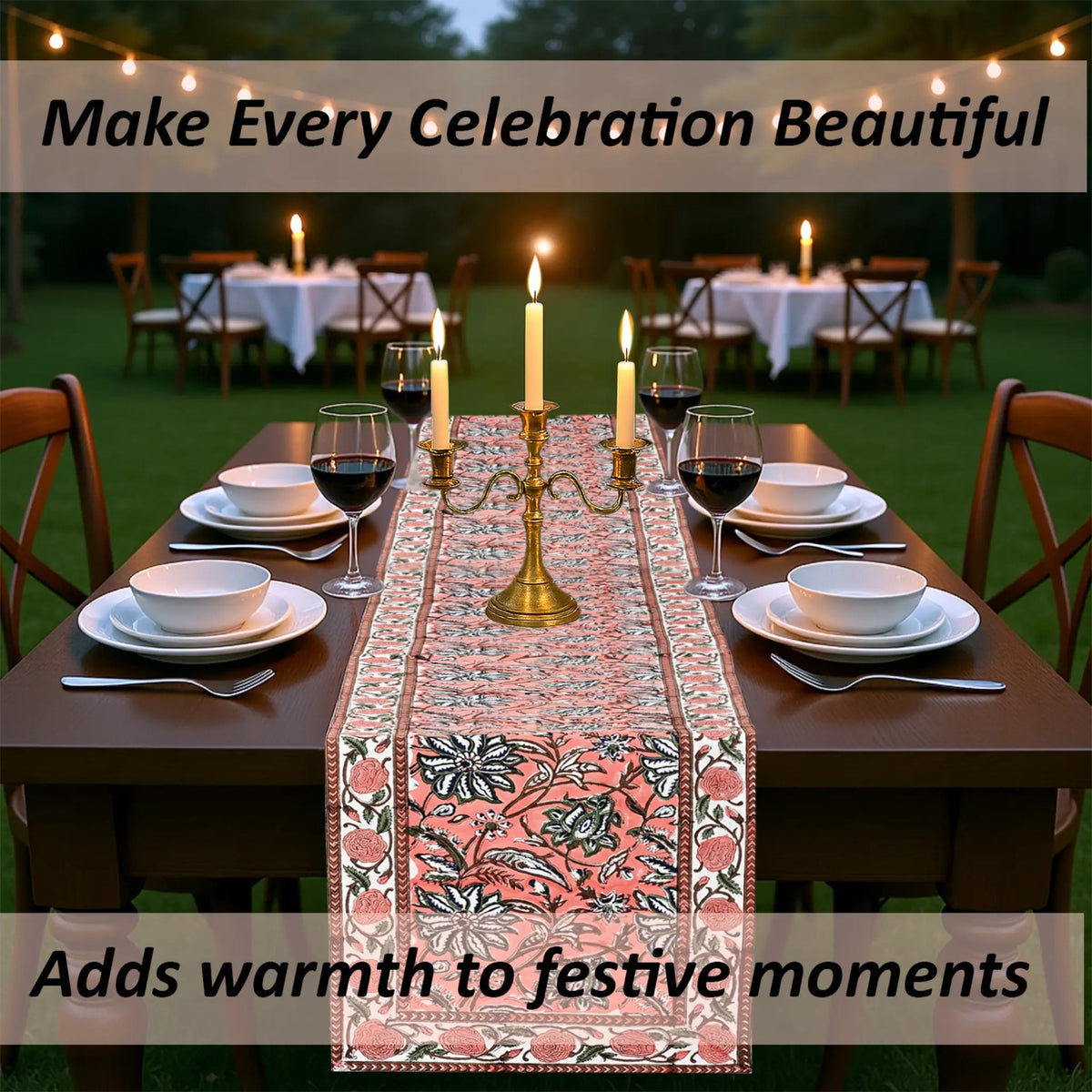 Dining table set for a celebration with a decorative table runner, candles, and wine glasses.