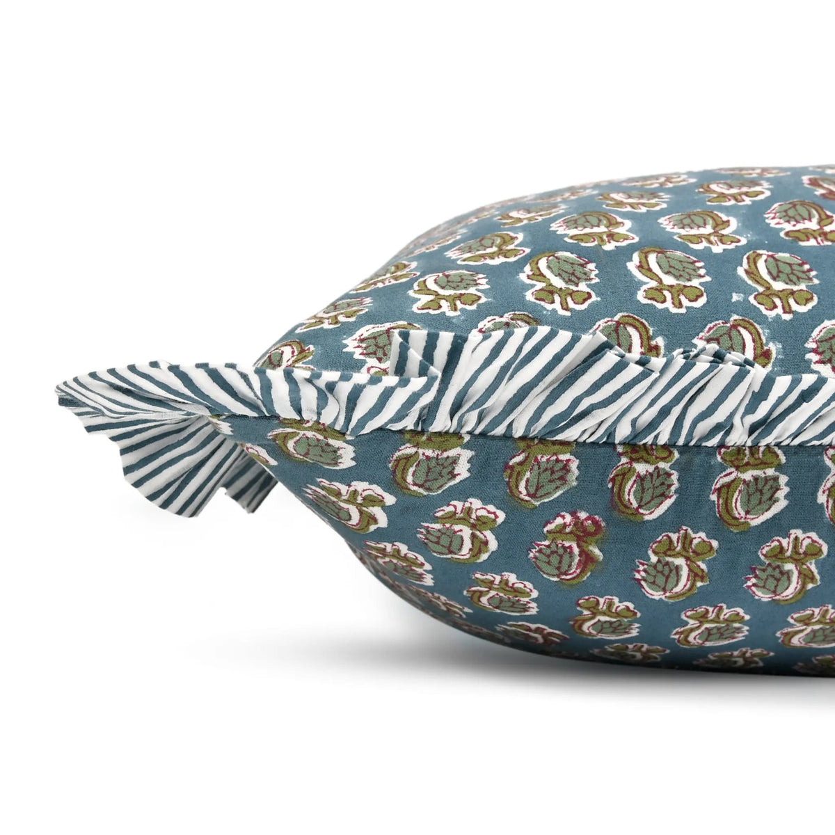 Decorative pillow with a floral pattern on a blue background