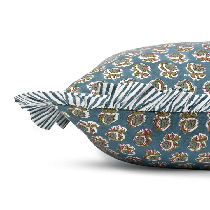 Decorative pillow with a floral pattern on a blue background