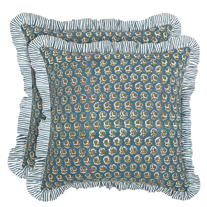 Decorative pillow with floral pattern and ruffled edge on a white background