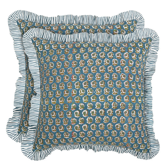 Decorative pillow with floral pattern and ruffled edge on a white background