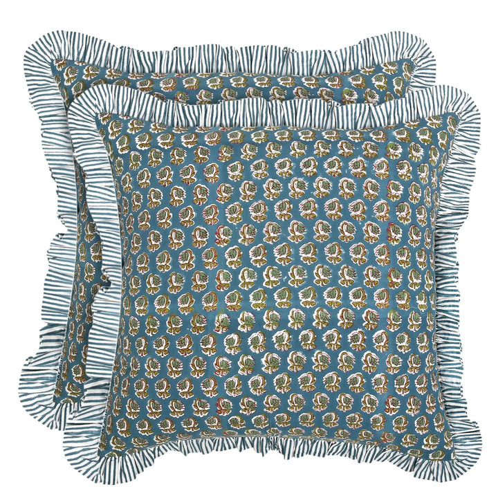 Decorative pillow with floral pattern and ruffled edge on a white background