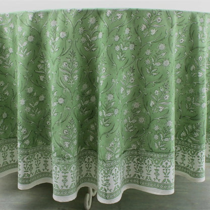 Green floral patterned tablecloth on a white background