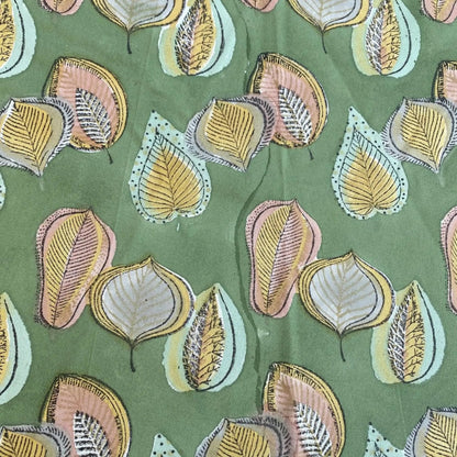 Pattern of stylized leaves on a green background