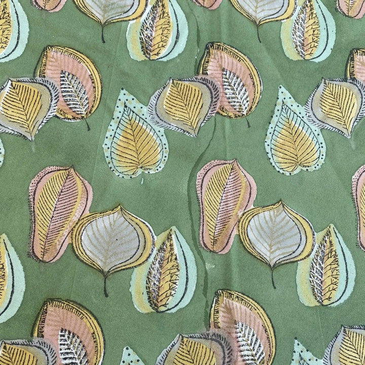 Pattern of stylized leaves on a green background