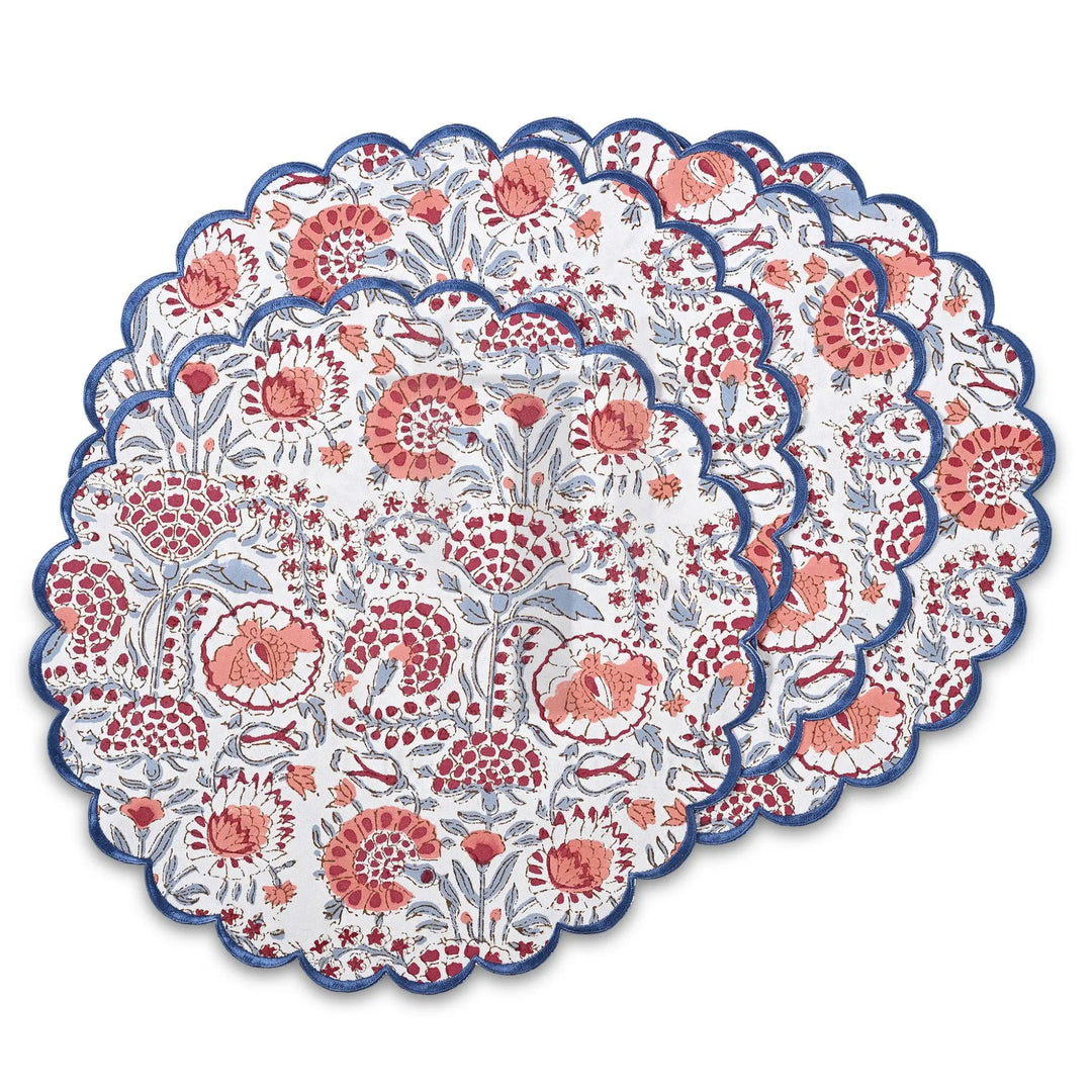 Round floral placemat with red and blue patterns on a white background