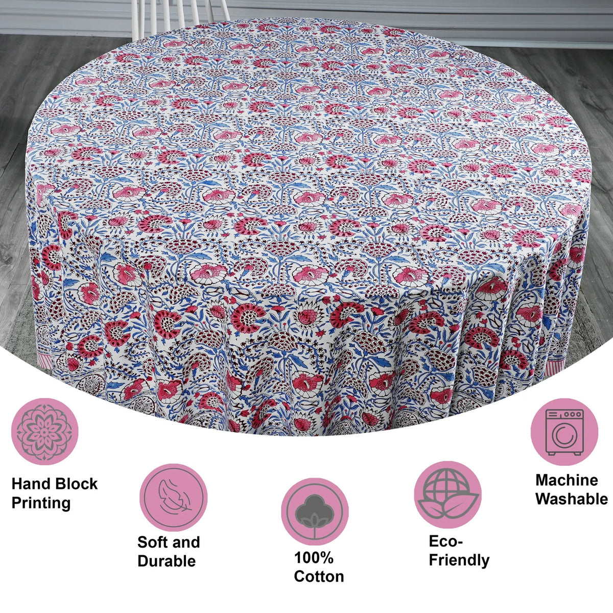 Round tablecloth with floral pattern on a wooden floor, featuring icons and text about material and care.