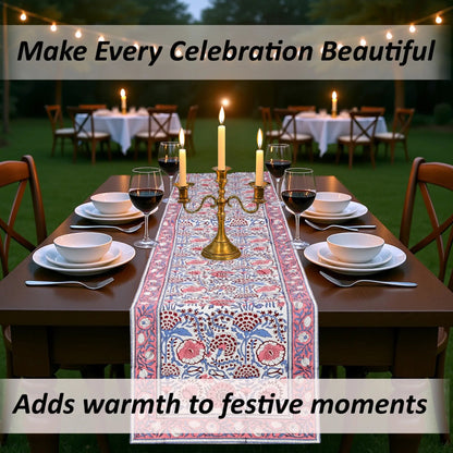 Decorated outdoor table with a floral table runner, candles, and wine glasses.