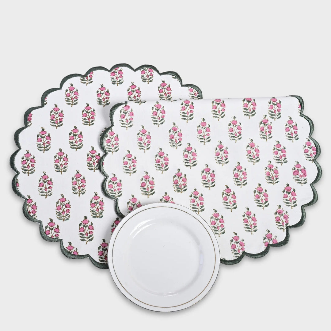 Set of floral patterned placemats on a white background