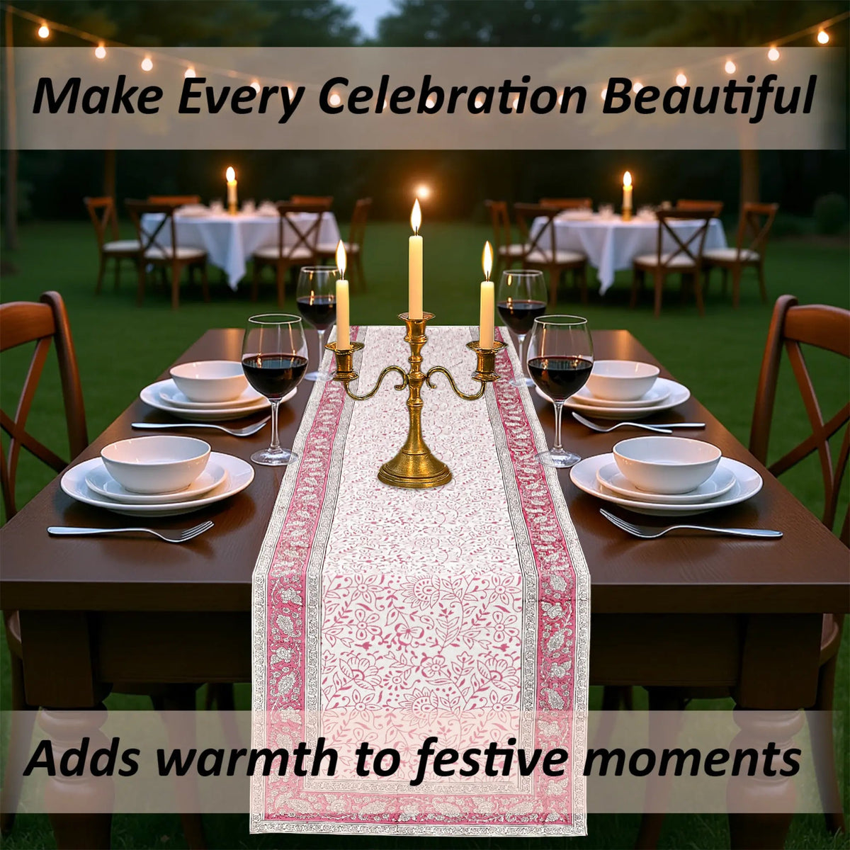 Dining table set for a celebration with candles and a decorative table runner, outdoors.