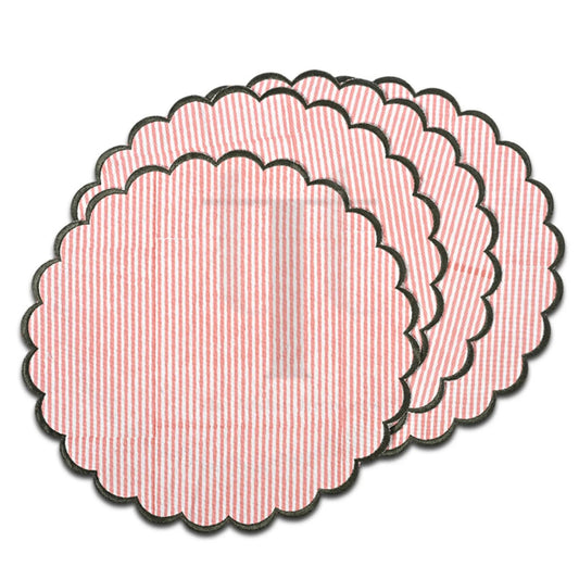 Set of pink textured circular coasters on a white background