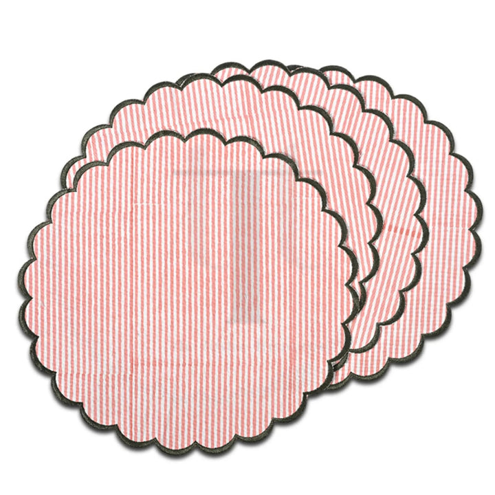 Set of pink textured circular coasters on a white background