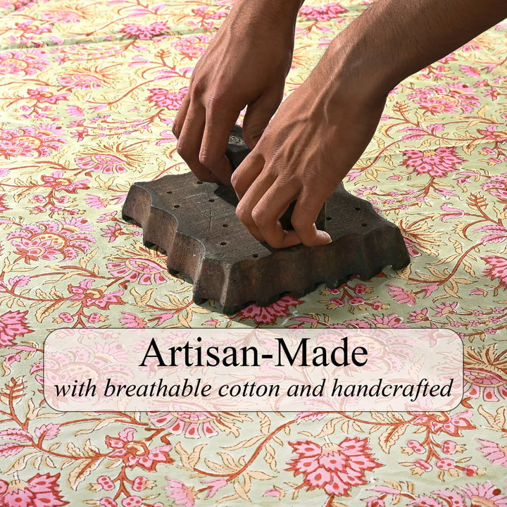 Hands using a wooden tool on floral fabric with &