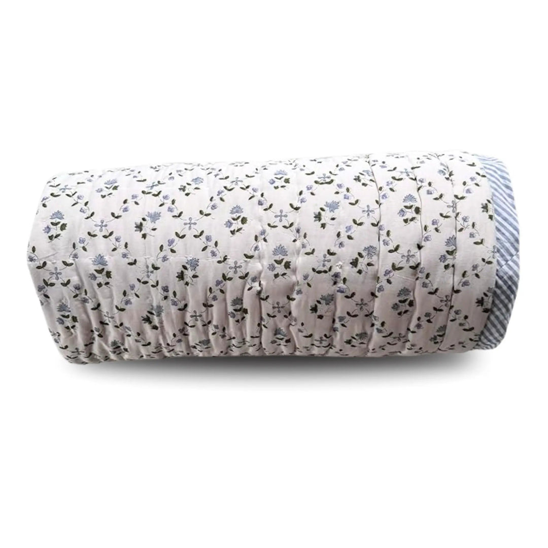 Rolled-up mat with floral pattern on a white background