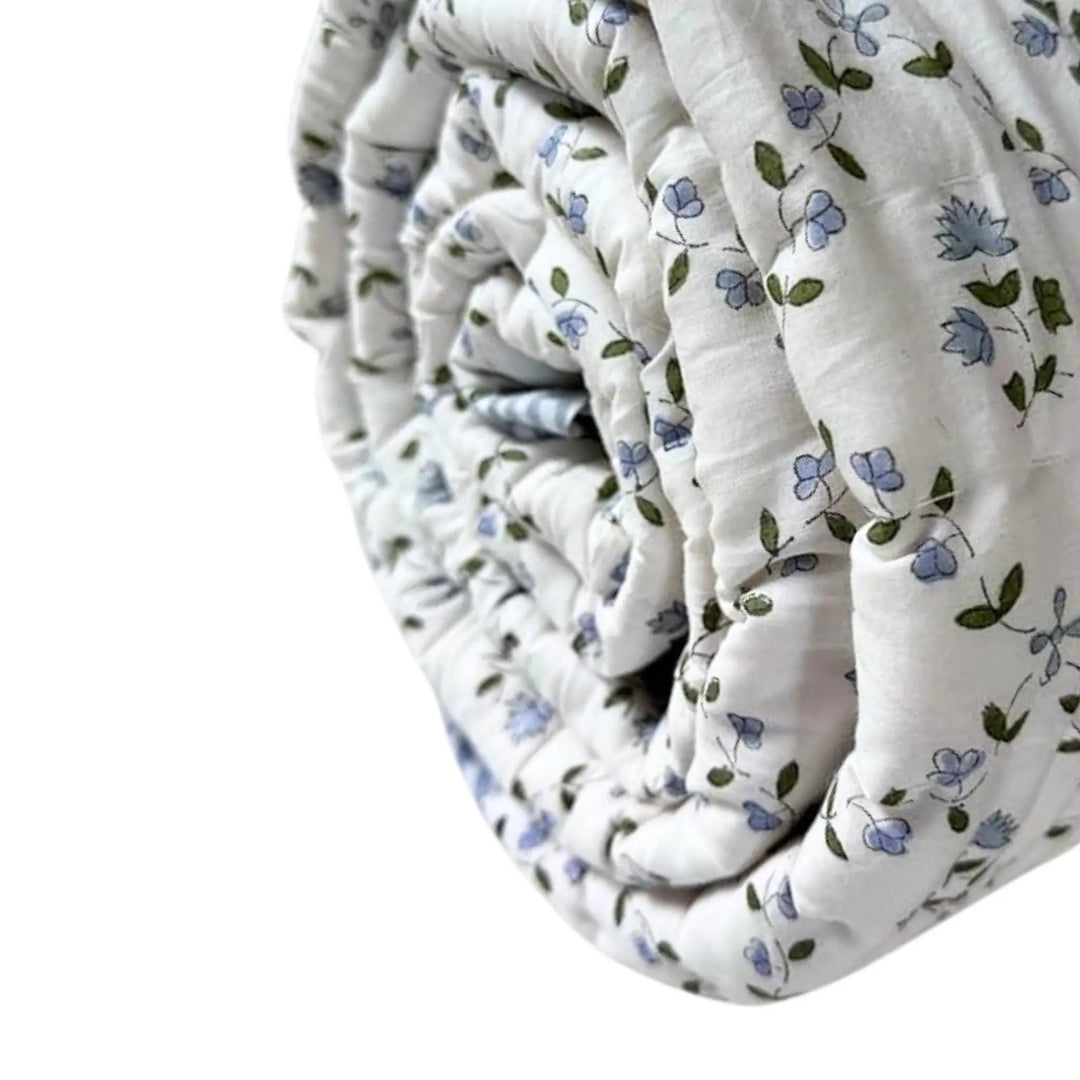 Folded fabric with floral pattern on a white background