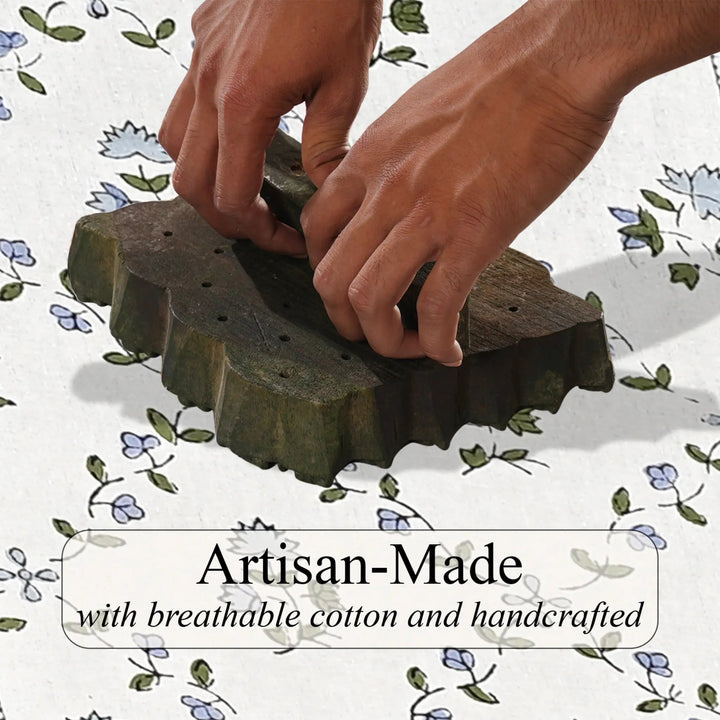 Hands working with a green woven product on a floral-patterned background, with text &