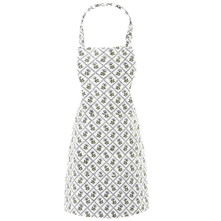 White dress with green floral pattern on a white background