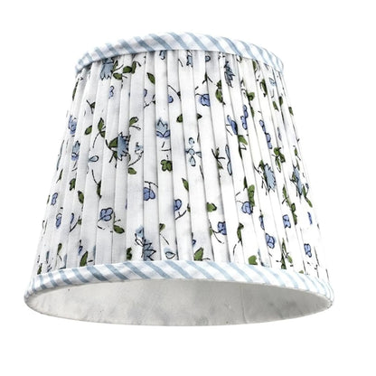 Floral patterned lampshade with blue stripes on a white background