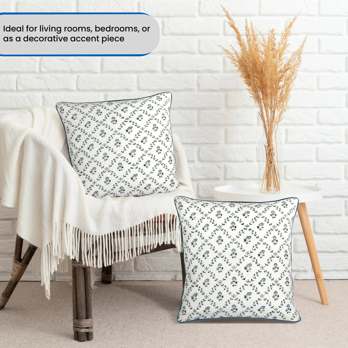 Decorative pillows on a chair with a white brick wall background