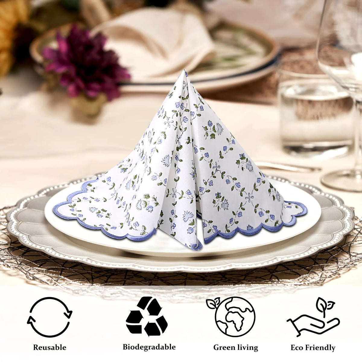 Floral-patterned folded napkin on a plate with eco-friendly icons below