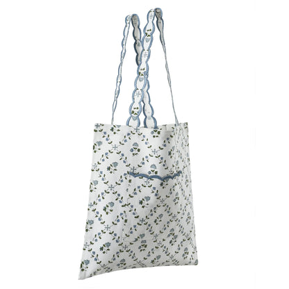 Floral-patterned tote bag with blue accents on a white background