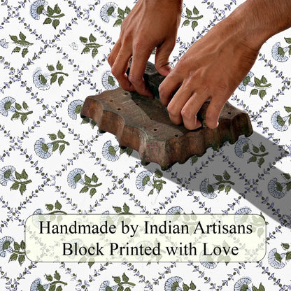 Hand block printing on fabric with text 'Handmade by Indian Artisans Block Printed with Love'.