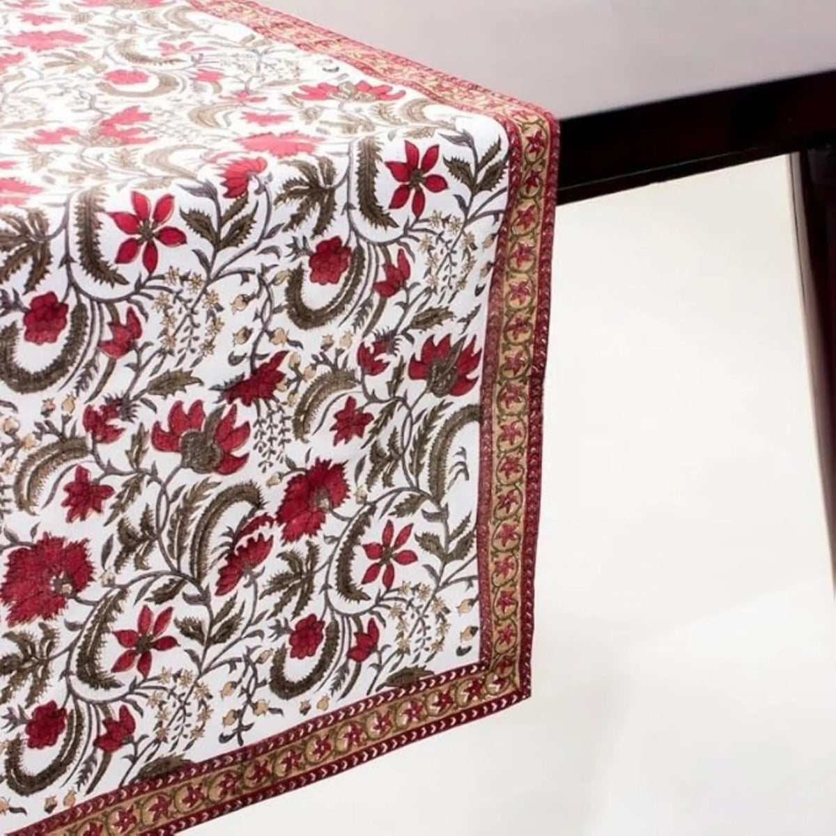 Floral patterned table runner on a white surface