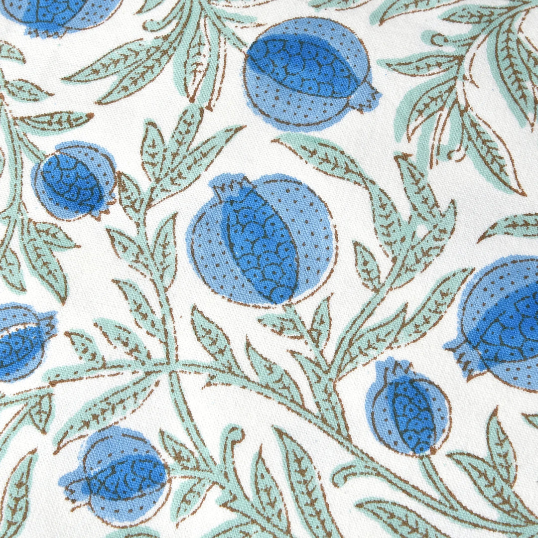 Pattern of blue floral buds and green leaves on a white background